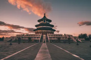 Stunning view of the Temple of Heaven in Beijing under a vibrant sunset sky. jigsaw puzzle