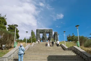 People visit the Chronicle of Georgia monument on a sunny day in Tbilisi. jigsaw puzzle
