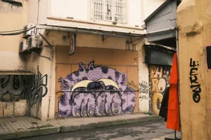 Colorful graffiti art on a building facade in a city alley, showcasing urban creativity. jigsaw puzzle