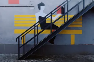 Steel staircase on a modern mural wall, showcasing artistic urban design with bold colors. jigsaw puzzle