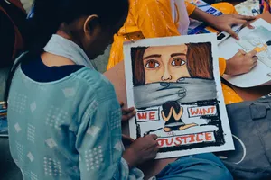 A young girl creates powerful protest art to raise awareness for women's justice in Kolkata, India. jigsaw puzzle