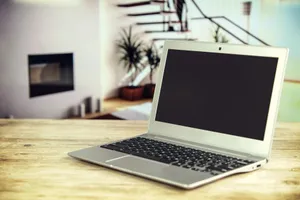 Sleek laptop on a wooden desk with blurred contemporary home interior in the background. jigsaw puzzle