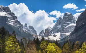 Breathtaking view of the Brenta Dolomites with lush forest and bright blue sky. jigsaw puzzle