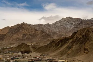 A stunning mountain landscape in Ladakh with rugged terrain and small settlements below. jigsaw puzzle