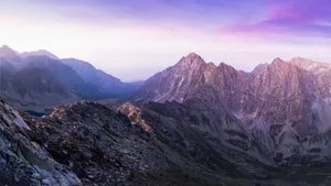 Stunning view of a rocky mountain range during sunrise with a colorful sky. jigsaw puzzle