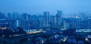 Peaceful view of Kuala Lumpur's skyline during blue hour with city lights. jigsaw puzzle