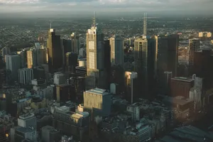 High-angle cityscape of Melbourne's skyline with modern skyscrapers at dusk. jigsaw puzzle