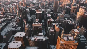 Experience the breathtaking aerial view of Chicago's snow-dusted skyline captured in the evening light. jigsaw puzzle