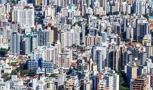 A vibrant aerial view of a densely packed urban cityscape with numerous skyscrapers. jigsaw puzzle