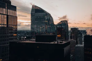 Stunning view of modern skyscrapers reflecting sunset colors, showcasing urban architecture. jigsaw puzzle