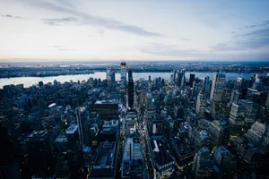 Stunning aerial view of New York City skyline at dusk, showcasing skyscrapers and the Hudson River. jigsaw puzzle
