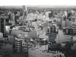 Black and white aerial cityscape showcasing dense urban buildings. jigsaw puzzle