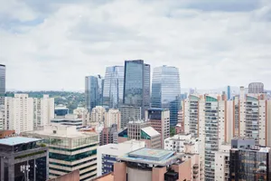 Aerial view of Sao Paulo showcasing modern architecture and skyline under a cloudy sky. jigsaw puzzle