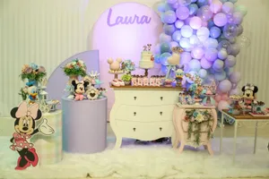 A vibrant Minnie Mouse themed birthday setup with balloons and decor. jigsaw puzzle