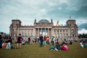Tourists relaxing on the lawn in front of the historic Reichstag Building in Berlin, Germany during a summer day. jigsaw puzzle