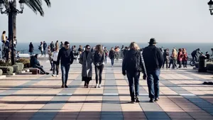 People strolling along a scenic waterfront promenade in Nerja, Spain. jigsaw puzzle
