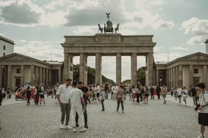 Enjoy a bustling scene at Berlin's iconic Brandenburg Gate, filled with a diverse crowd on a sunny day. jigsaw puzzle