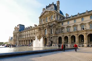 View of the Louvre Museum with a fountain in the courtyard, a popular tourist spot in Paris. jigsaw puzzle