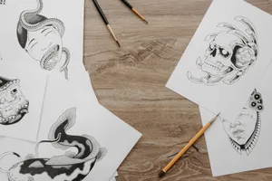 Creative sketch designs and drawing tools neatly arranged on a wooden table in a flat lay setup. jigsaw puzzle