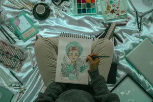 Artist painting with watercolors on sketchbook surrounded by materials. jigsaw puzzle