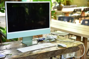 Modern computer setup on a rustic outdoor desk, perfect for remote work and creativity. jigsaw puzzle