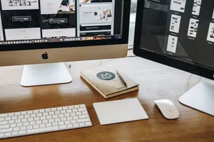 A minimalist desk setup featuring dual monitors, keyboard, mouse, and notebook for productivity. jigsaw puzzle
