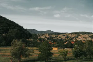 Serene landscape of rural Hungary with hills and trees under a clear sky. jigsaw puzzle