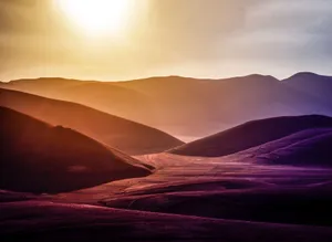 Dramatic landscape of sunset over Montemonaco's hilly terrain, showcasing vibrant natural beauty. jigsaw puzzle