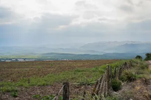 Scenic view of fields and mountains under a cloudy sky in Córdoba, Argentina. jigsaw puzzle