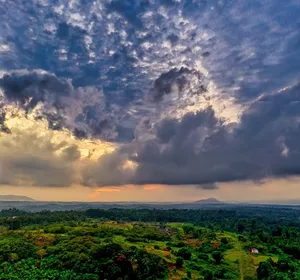 Aerial view of lush countryside with dramatic clouds during sunset in Banten, Indonesia. jigsaw puzzle