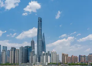A vibrant view of the Shanghai skyline featuring iconic skyscrapers under a clear blue sky. jigsaw puzzle