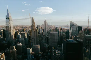 A stunning panoramic view of the New York City skyline featuring iconic skyscrapers at day. jigsaw puzzle