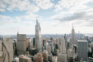 High rise skyscrapers with modern empire state building located against cloudy sky in center of New York city in Manhattan jigsaw puzzle