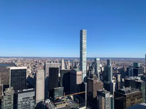 A breathtaking view of New York City skyline with iconic skyscrapers under a clear blue sky. jigsaw puzzle