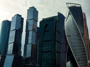 Modern skyscrapers of Moscow City skyline captured under an overcast sky, highlighting architectural design. jigsaw puzzle
