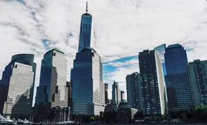 Skyline view of New York City featuring the iconic Freedom Tower and surrounding skyscrapers. jigsaw puzzle
