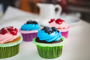 Delicious colorful cupcakes topped with fresh berries, perfect for a celebration or sweet indulgence. jigsaw puzzle