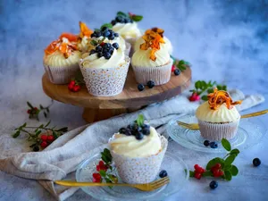 Aesthetic cupcakes topped with blueberries on a rustic stand, perfect for dessert inspiration. jigsaw puzzle