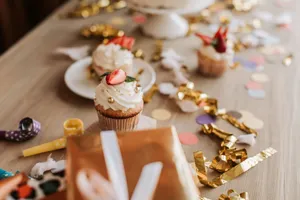Delicious strawberry-topped cupcakes with festive confetti, perfect for a celebration. jigsaw puzzle