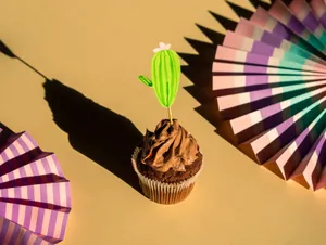 A delicious chocolate cupcake with cactus decoration on a pastel background. jigsaw puzzle