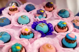 Colorful decorative desserts arranged with vibrant packaging for a festive occasion. jigsaw puzzle