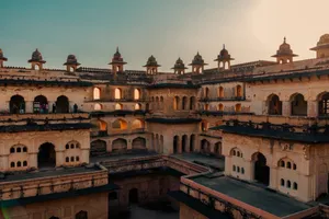 Stunning view of Raja Mahal's 17th-century architecture in Orchha, Madhya Pradesh at sunset. jigsaw puzzle