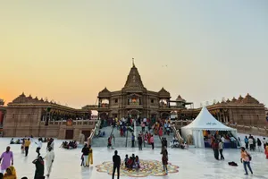 A lively scene at a famous temple with people gathering during sunset. jigsaw puzzle