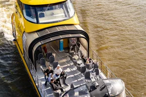 Tourists enjoy a sunny cruise on a modern sightseeing boat in Moskva River, Russia. jigsaw puzzle
