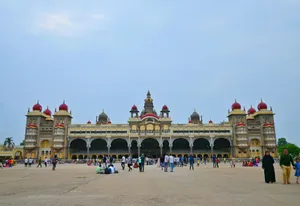 Explore the magnificent Mysore Palace in Mysuru, showcasing stunning architecture with a vibrant crowd. jigsaw puzzle