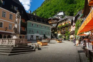 Picturesque view of a historic square in Hallstatt, Austria with colorful buildings and lively atmosphere. jigsaw puzzle