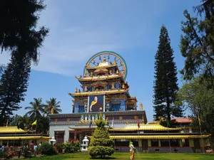 Vibrant Buddhist temple in Gollarahosahalli, India under clear blue sky. jigsaw puzzle