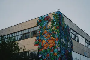 Vibrant street art mural on an industrial building facade in urban setting. jigsaw puzzle
