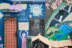 Colorful street art and graffiti on urban wall featuring eye and lip designs in a creative mural. jigsaw puzzle