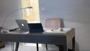 A clean and modern workspace with a laptop and tablet, emphasizing minimalist design. jigsaw puzzle